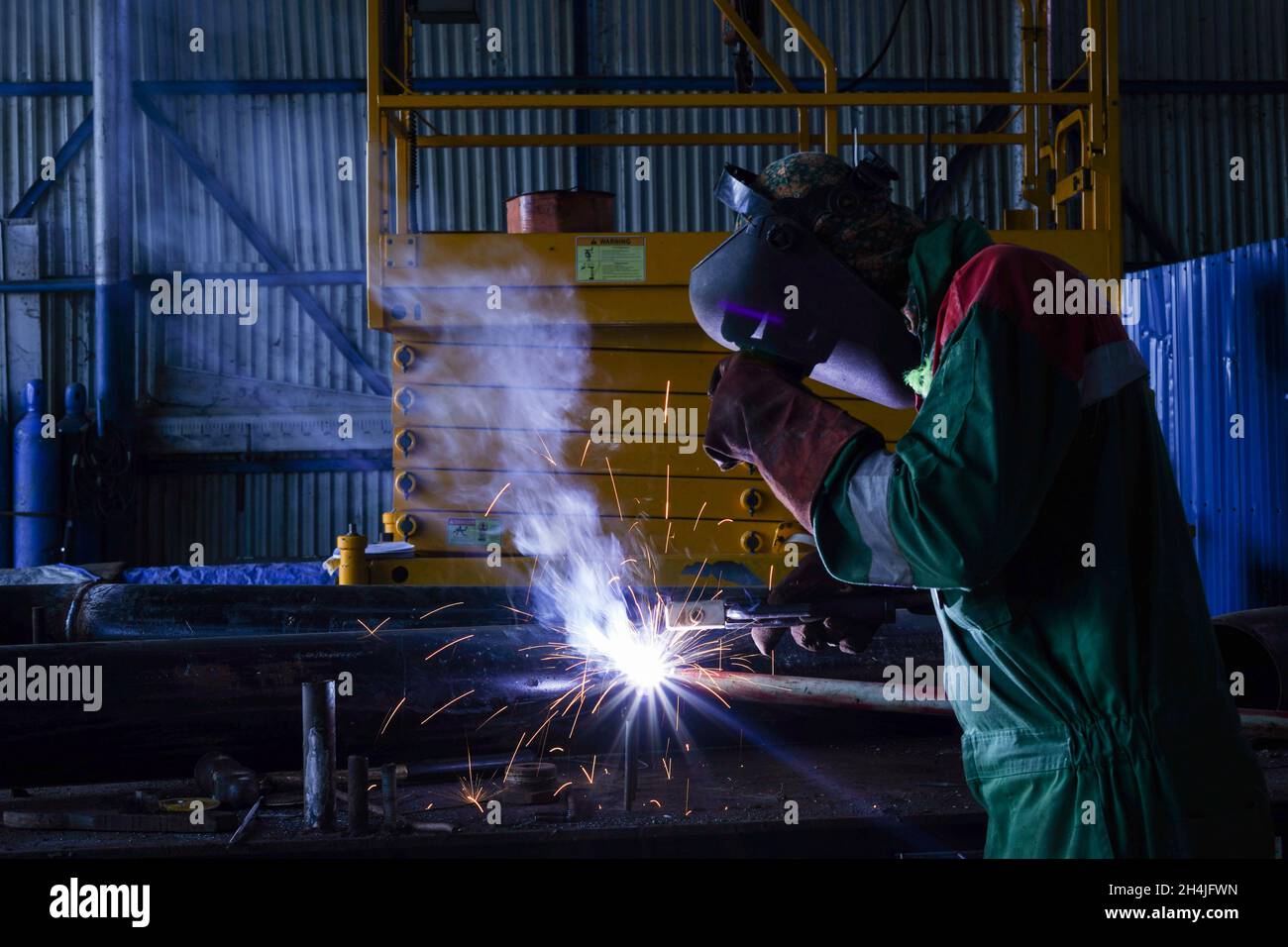 Welding works at workshop Stock Photo