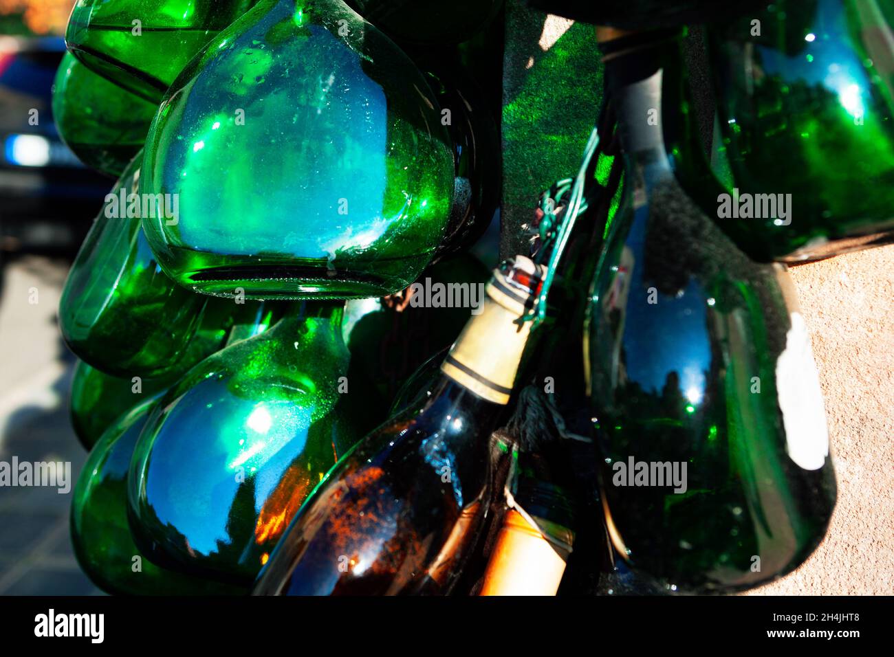 Abstract bottle decoration . Green glass decor . Empty alcohol bottles