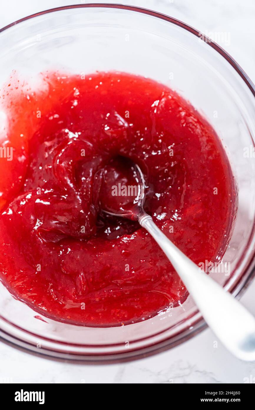Strawberry cake filling in a glass mixing bowl Stock Photo Alamy