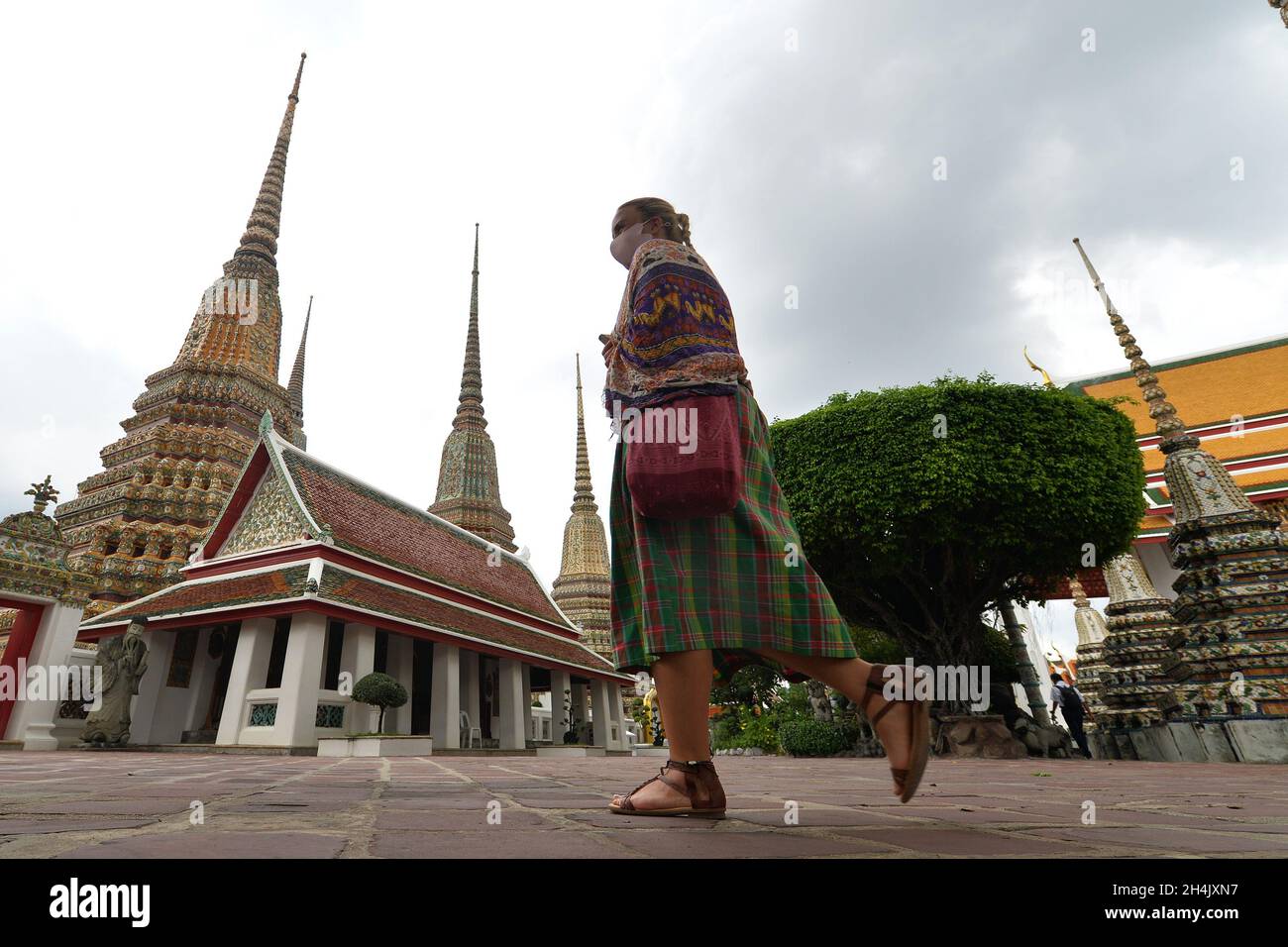 Bangkok, Thailand. 2nd Nov, 2021. A tourist is seen at the Wat Pho temple in Bangkok, Thailand, on Nov. 2, 2021. Thailand on Monday reopened to vaccinated visitors from more than 60 countries and regions amid efforts to revive its pandemic-battered economy. Credit: Rachen Sageamsak/Xinhua/Alamy Live News Stock Photo