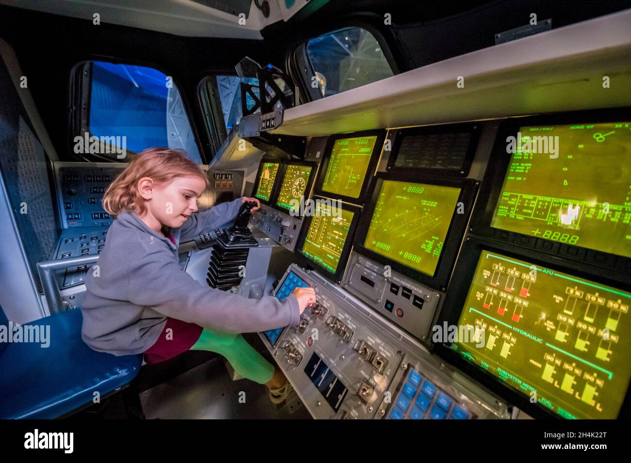 United States, Florida, Orlando, Cape Canaveral, Kennedy Space Center, space museum, child testing the cockpit in the cockpit of a life-size model of the shuttle Atlantis Stock Photo
