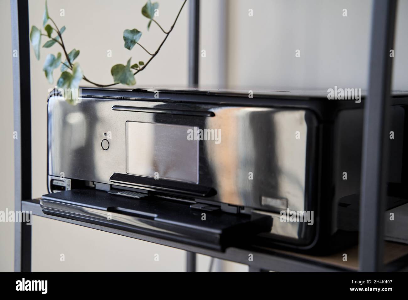 Black inkjet printer is on the shelf Stock Photo