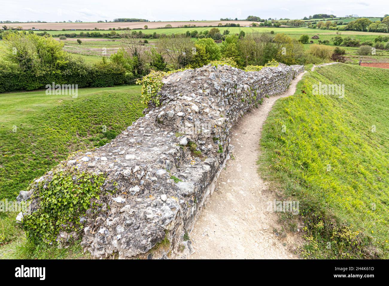 Part of the flint rubble masonry wall of the outer bailey at the medieval castle at Castle Acre, Norfolk UK Stock Photo
