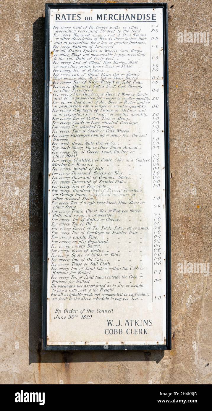 Historic poster listing the Tax Rates on Merchandise from the Cobb Clerk W J Atkins 1879 The Cobb Lyme Regis Dorset England UK GB Europe Stock Photo