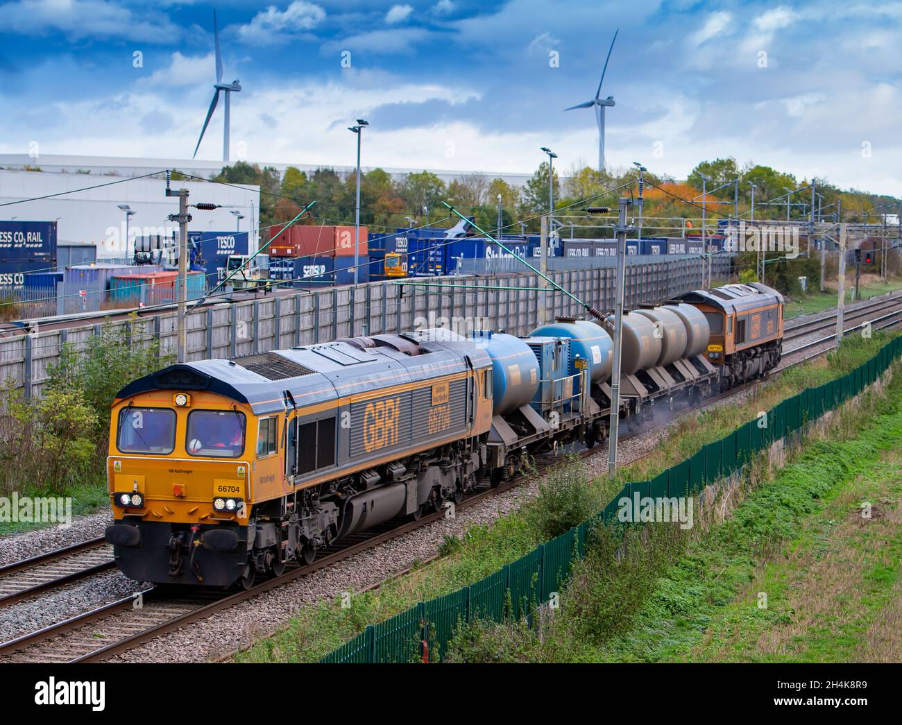 GB Railfreight Class 66's 66795 and 66704 pulling RHTT past DIRFT Stock Photo
