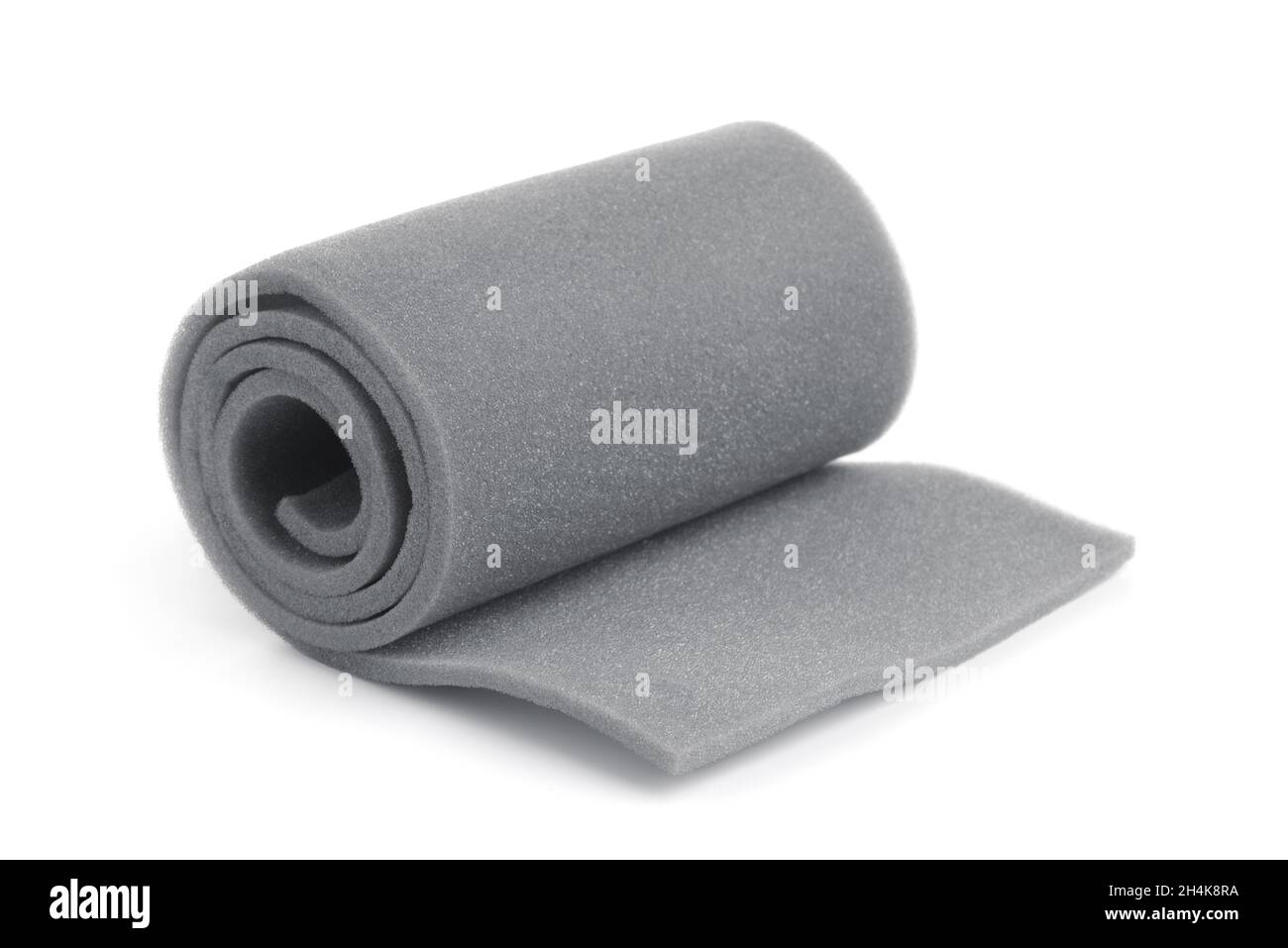 Rolled gray sponge foam sheet isolated in white Stock Photo