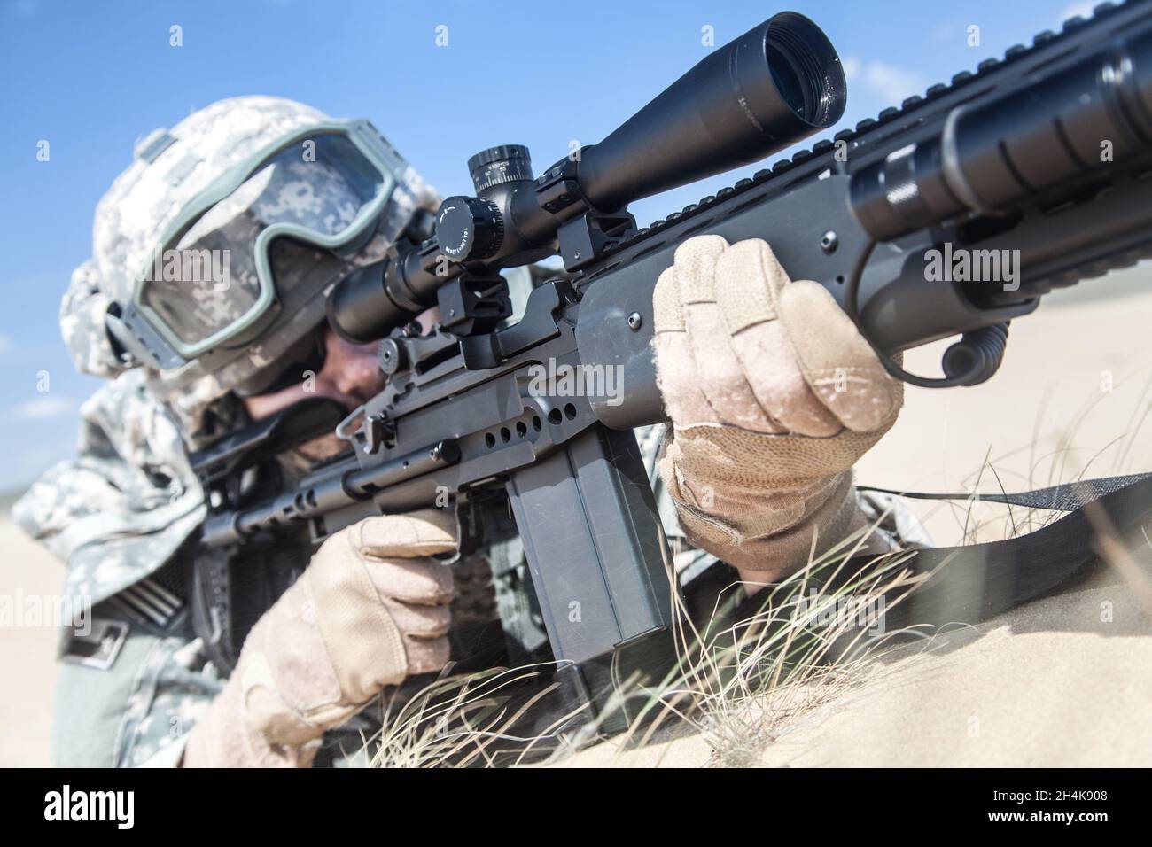 United states airborne infantry marksman in action in the desert