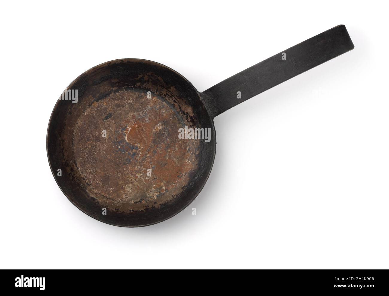 Top view of old empty cast iron frying pan isolated on white Stock Photo
