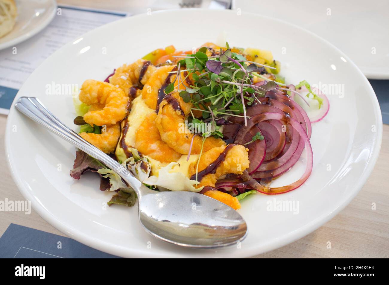 Fresh seafood salad with fried prawns. Closeup. Stock Photo