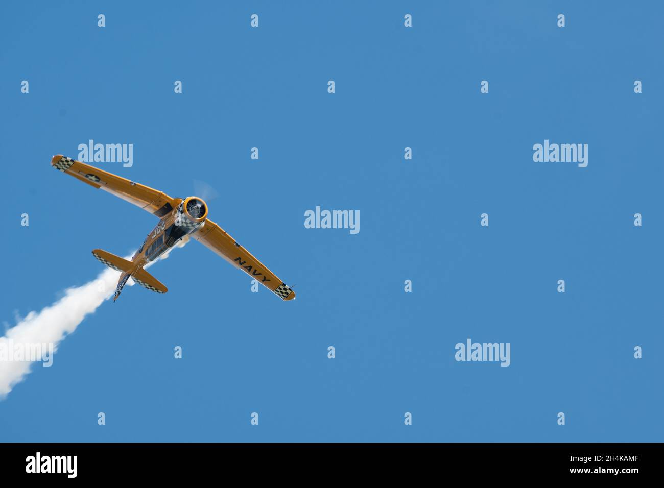 Flying aircraft against a blue sky during an airshow Stock Photo - Alamy