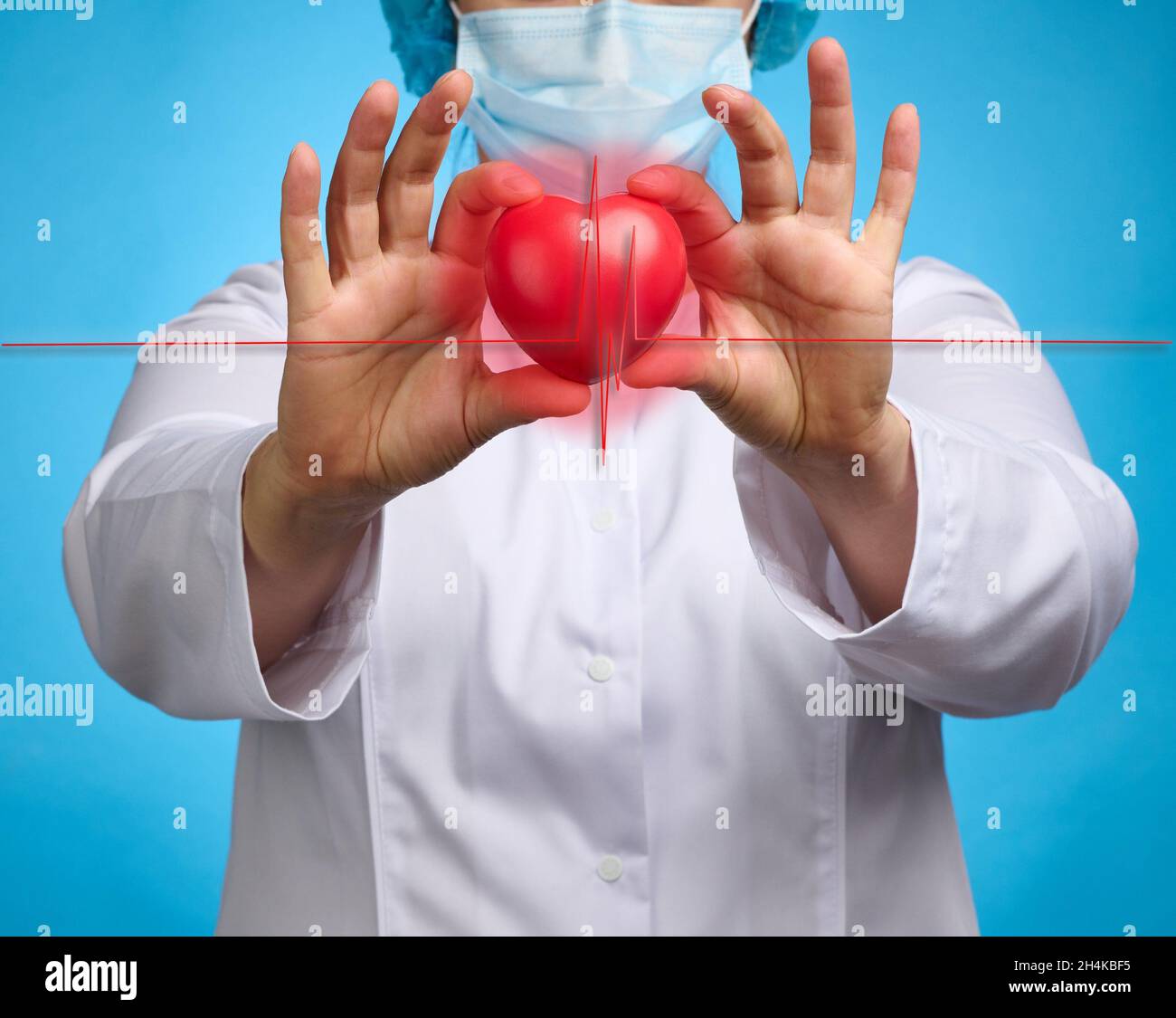 doctor in a white medical coat holding a red heart. Cardiovascular ...