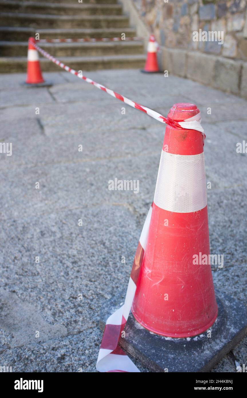 Security area marked by cones and tape. Selective focus. Stock Photo