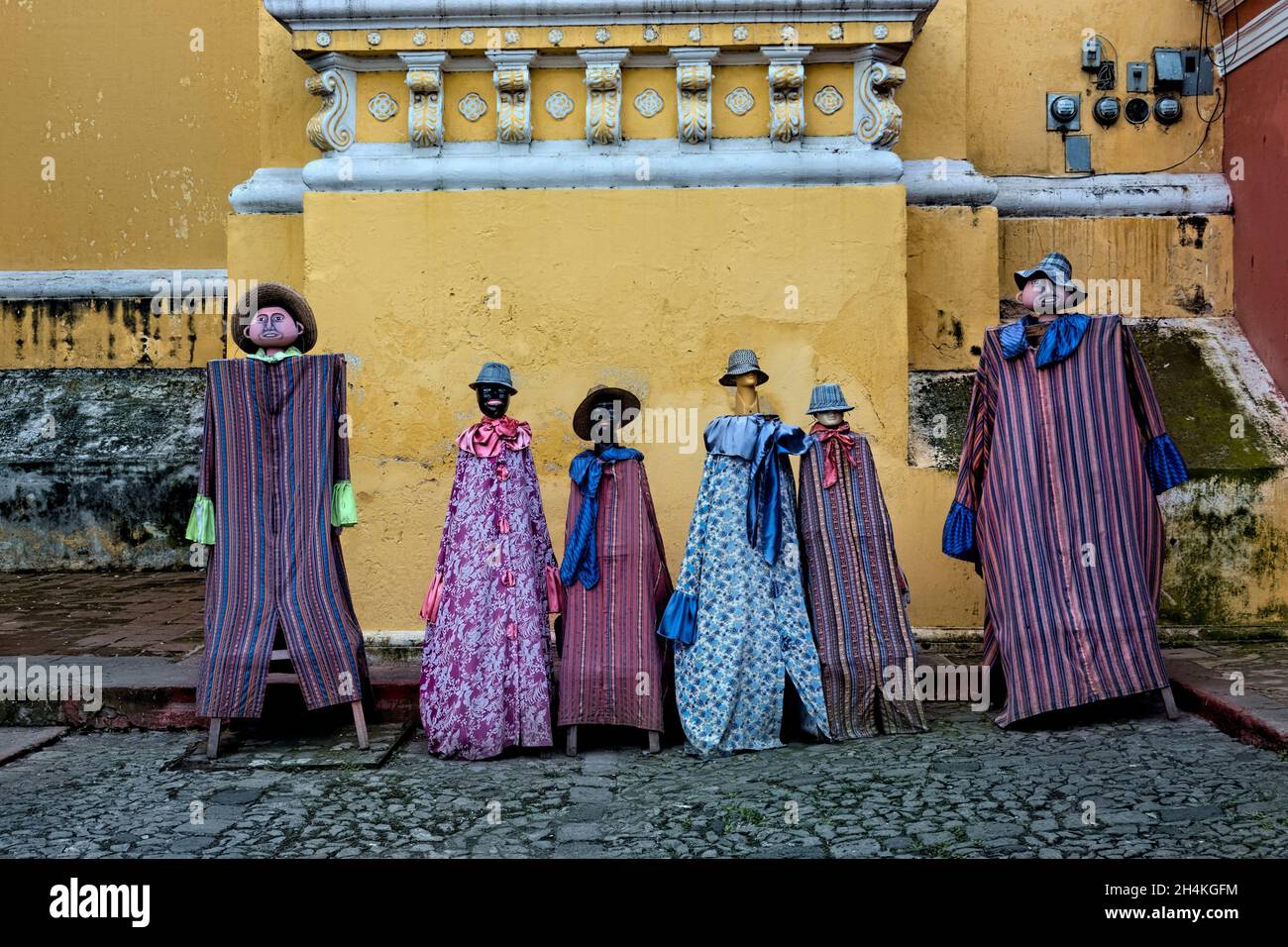 Traditionally dressed mannequins outside of the La Merced Convent, Antigua, Guatemala,. Stock Photo