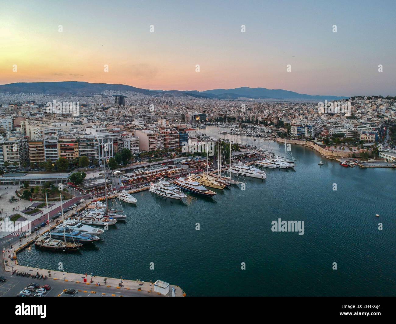 Aerial panorama view over the famous Marina Zeas, Peiraeus at sunset. Marina Zeas is a small crowded circular port with boats docked in Peiraeus city Stock Photo