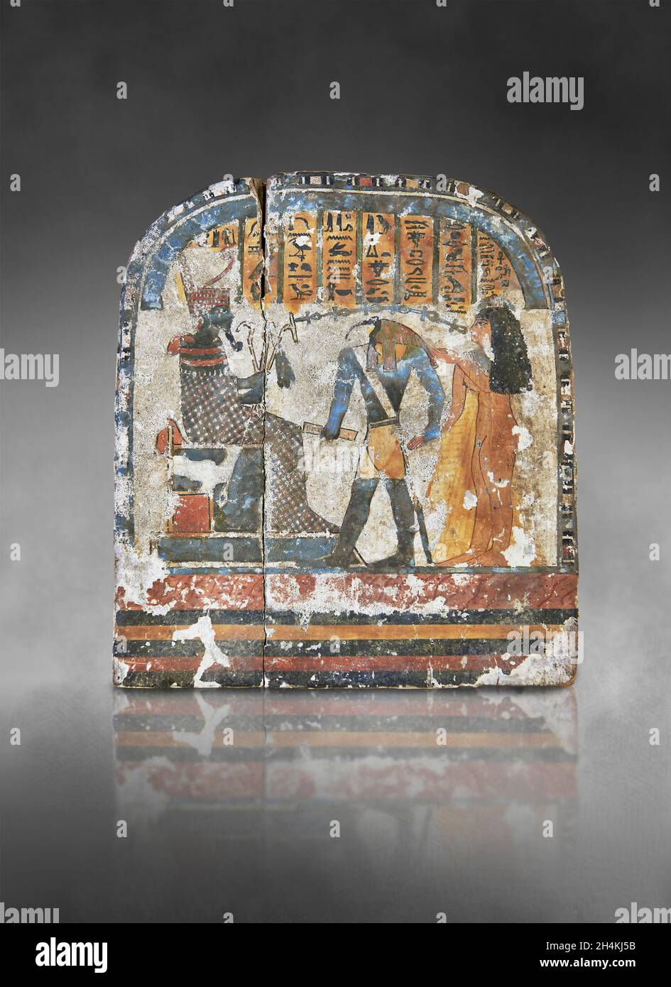 Ancient Egyptian stele the lady Nestarout led by the god Thoth before the god Atoum, circa 900 BC, 3rd Intermediate Period, painted wood. The Louvre M Stock Photo
