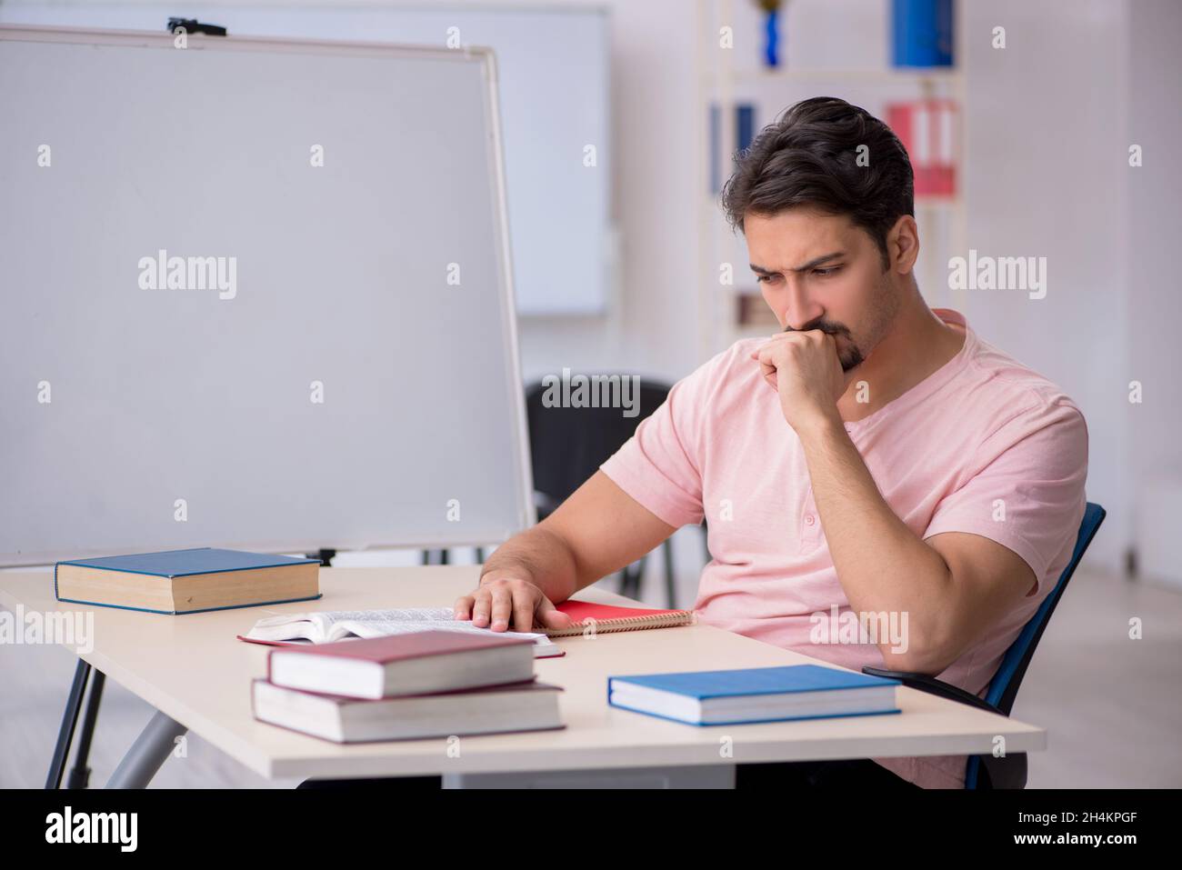 Getting Ready For Testing Young student preparing for exams in the classroom Stock Photo - Alamy