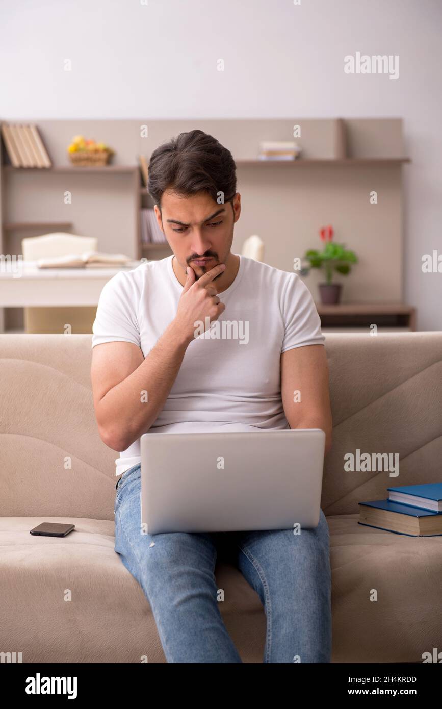 Young student studying at home during pandemic Stock Photo - Alamy