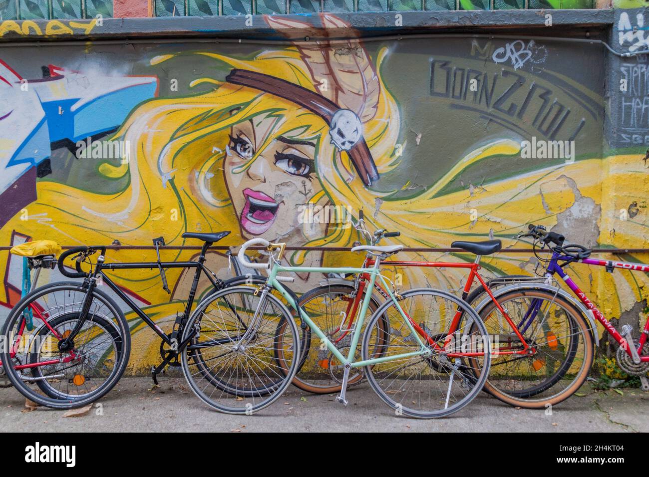 BERLIN, GERMANY - SEPTEMBER 1, 2017: Street art and bicycles in RAW Gelande subcultural compound in Berlin. Stock Photo