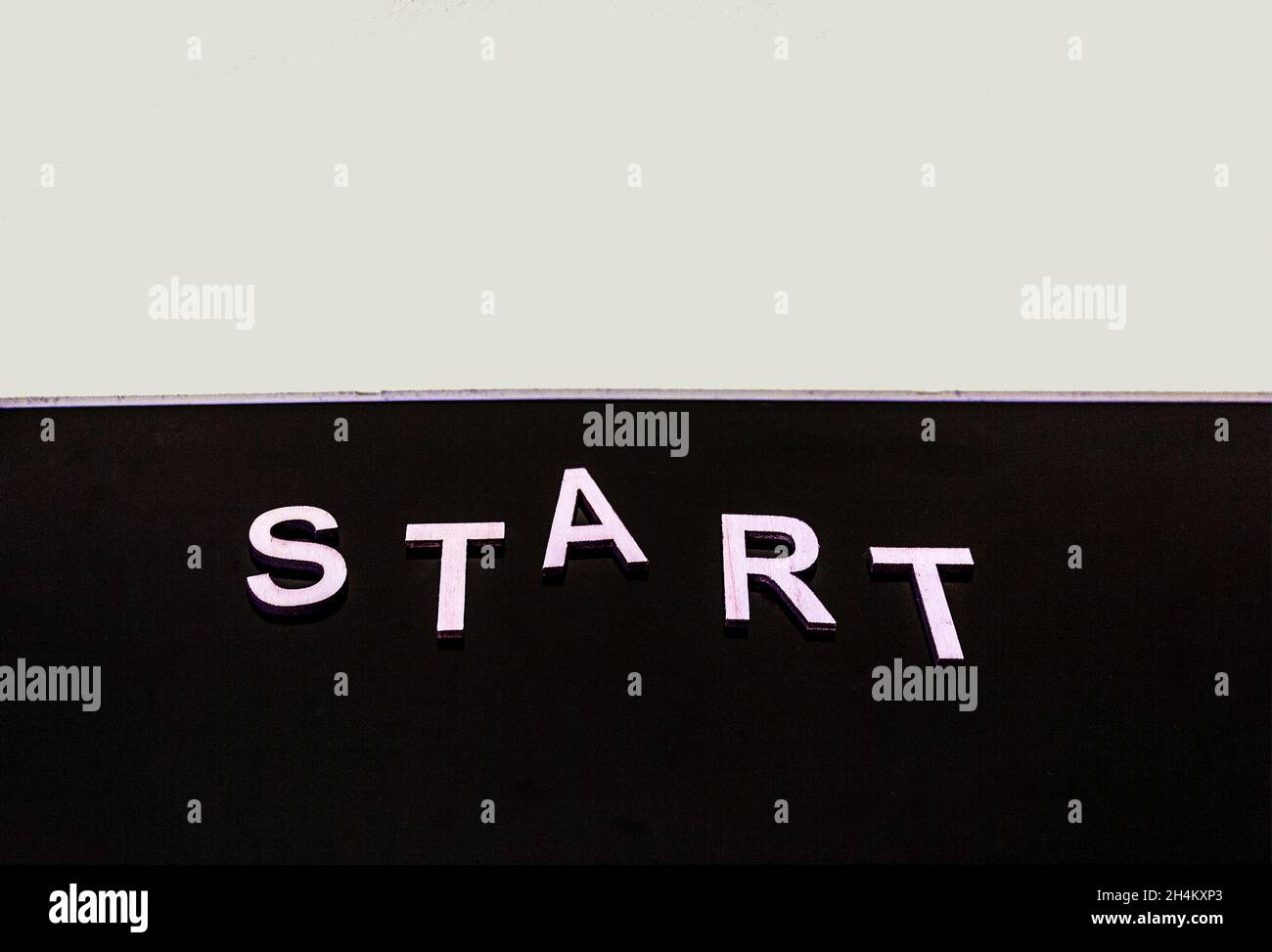 The word START is written on a black background. Half white background with black .2021 new year concept Stock Photo