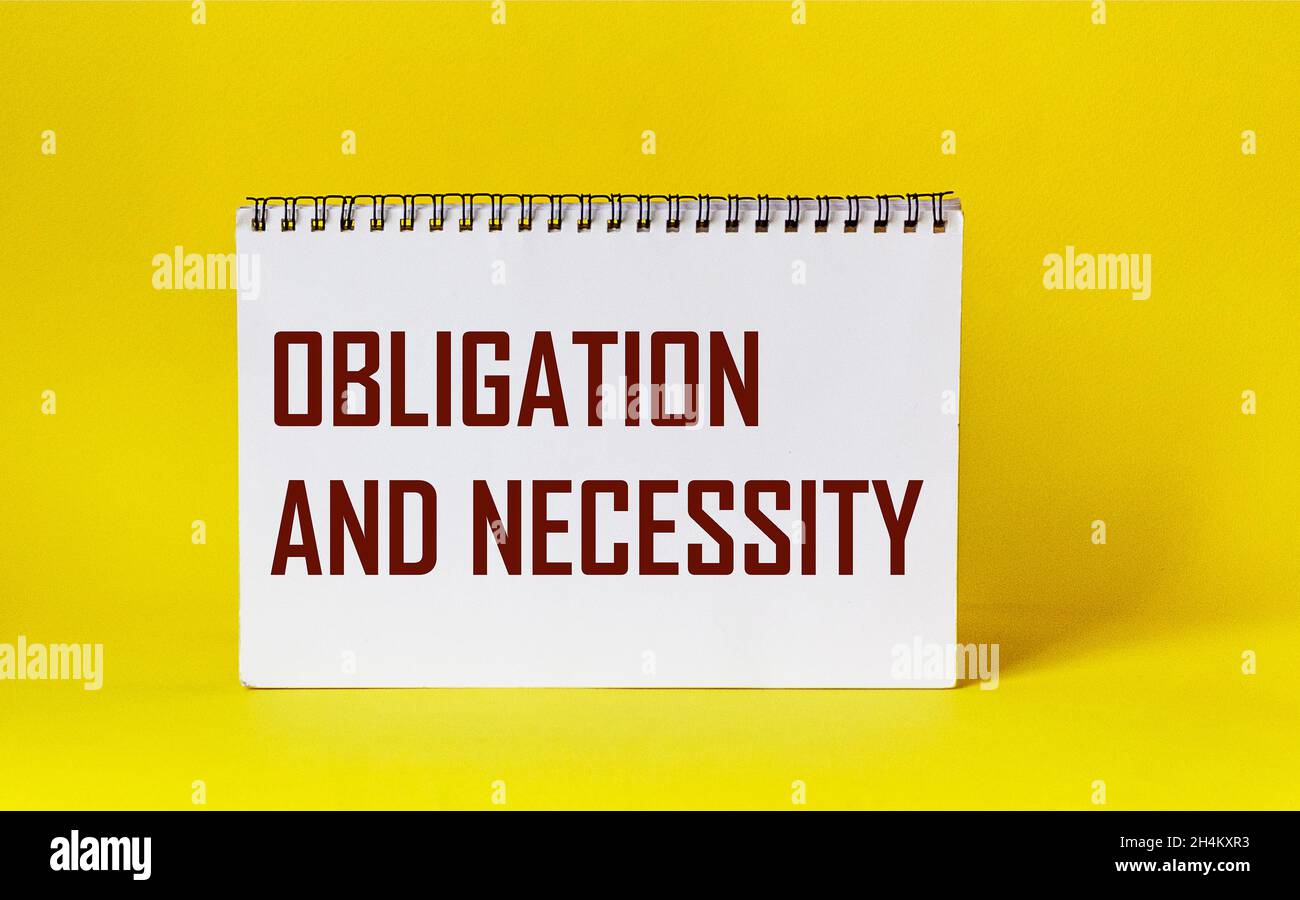 OBLIGATION AND NECESSITY - Word Written In A Notebook On A Yellow ...