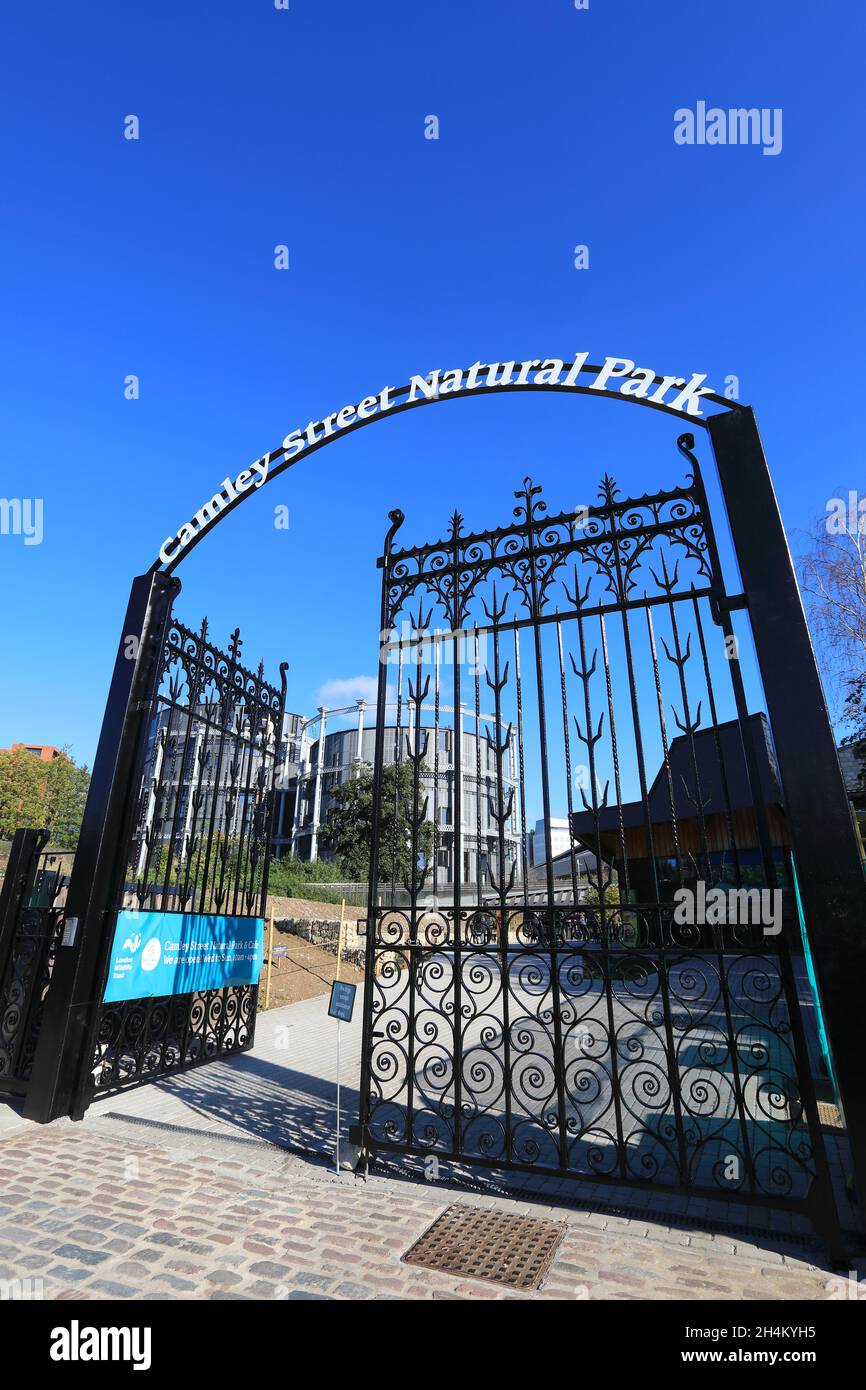 Entrance to the newly reopened Camley Street Natural Park, run by the London Wildlife Trust, with the Gasholders beyond, at Kings Cross, north London. Stock Photo