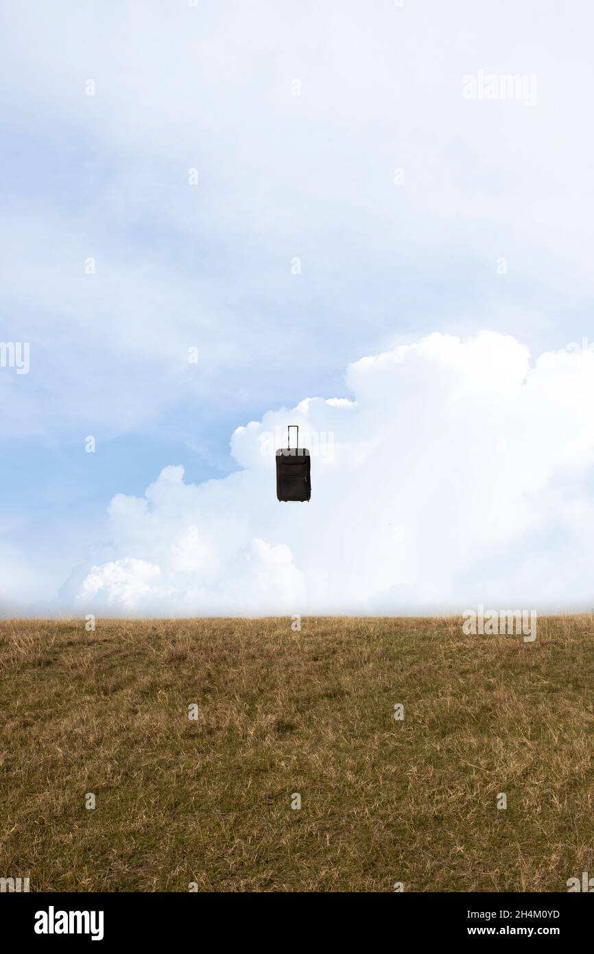 Traveling bag flying in the air Stock Photo Alamy