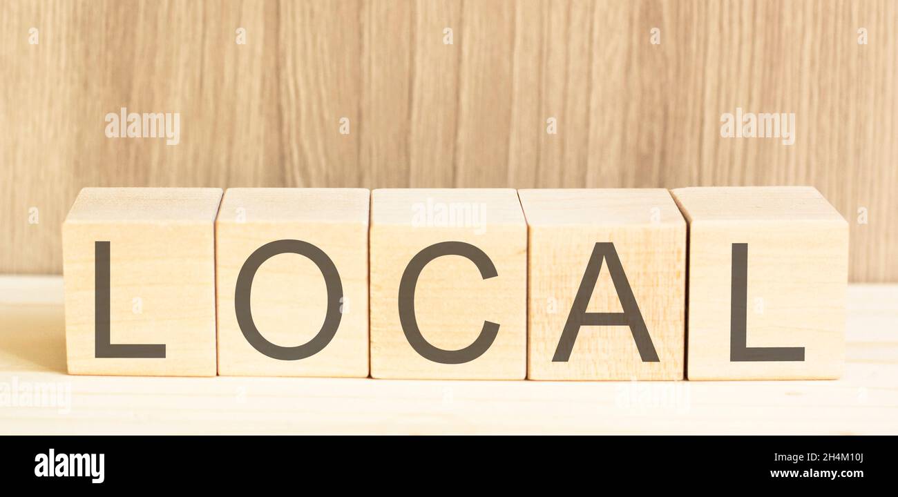 Local text on wooden cubes and a light background Stock Photo - Alamy