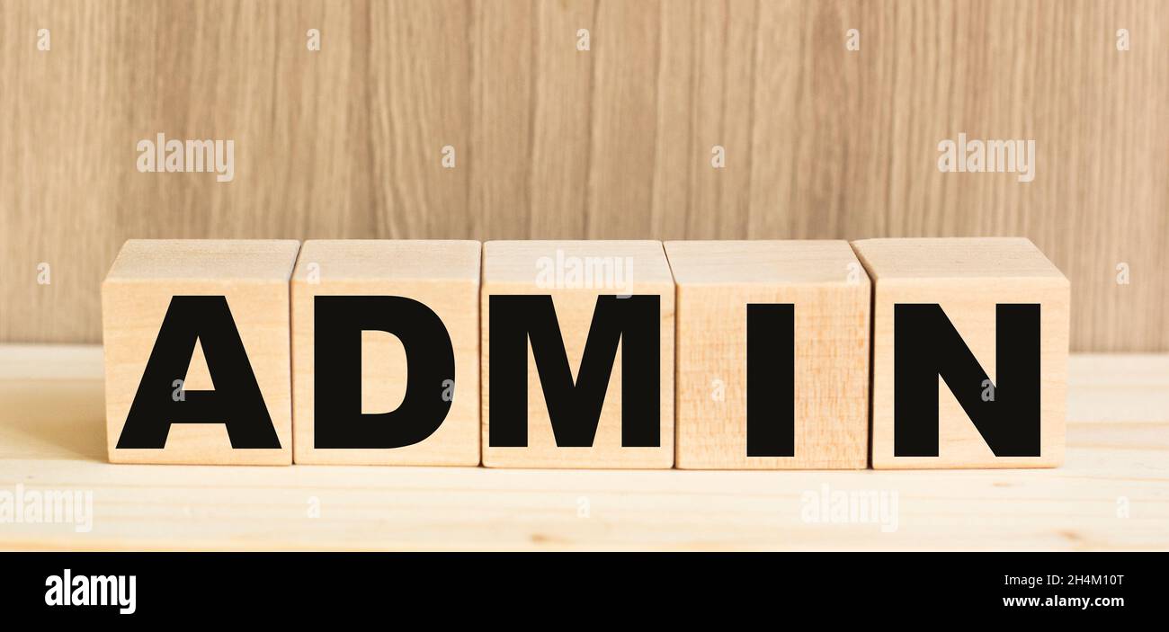 ADMIN word built with letters cubes on wooden table Stock Photo