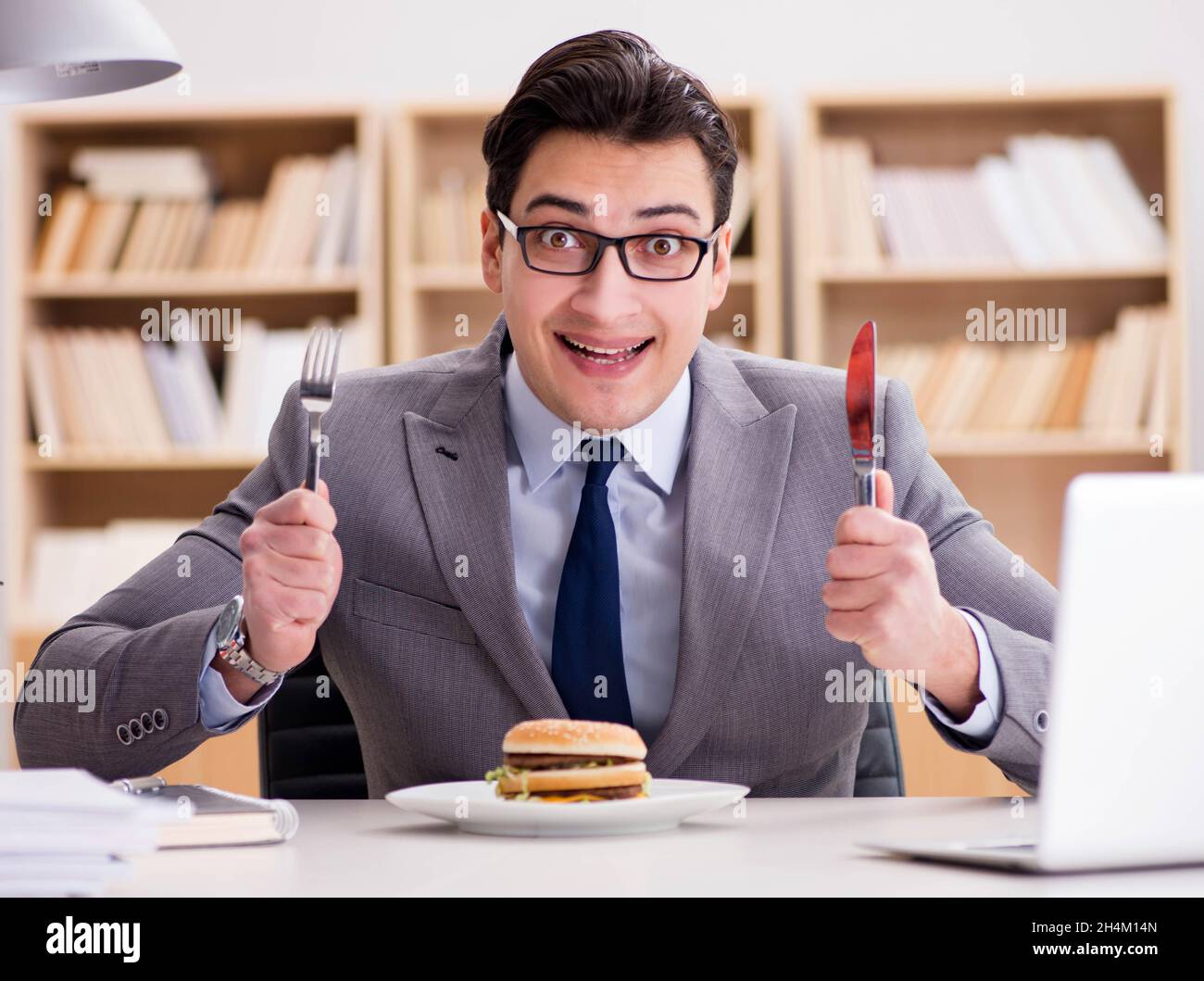 The Hungry Funny Businessman Eating Junk Food Sandwich Stock Photo Alamy the-hungry-funny-businessman-eating-junk-food-sandwich-stock-photo-alamy
