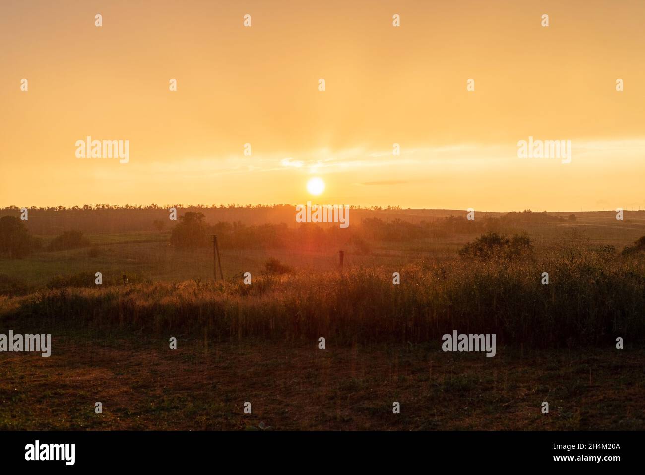 rustic orange sunset ukrainian sunset landscape gradient cloudy sky. Stock Photo