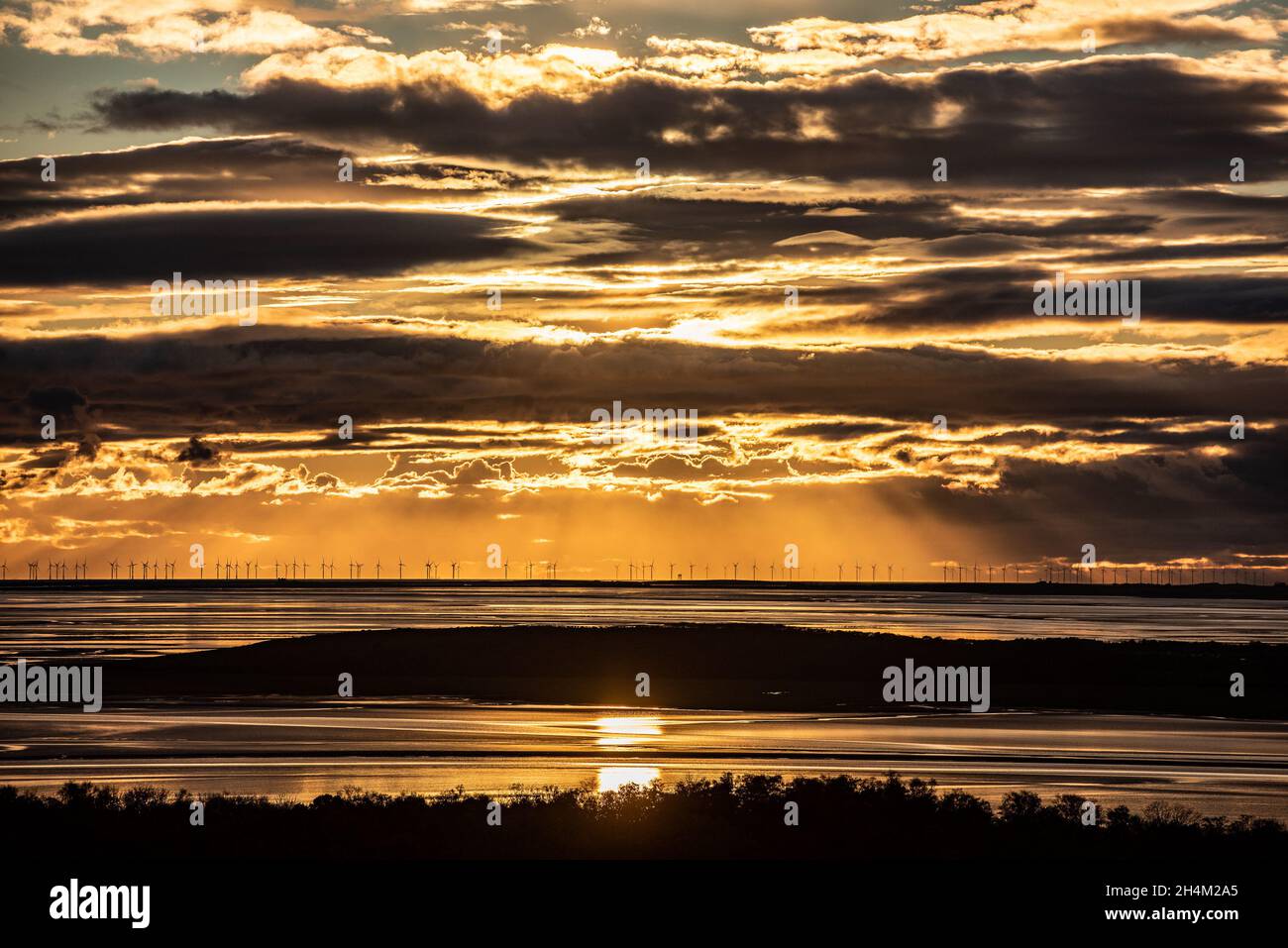 Barrow-in- Furness, Cumbria, UK. 3rd Nov, 2021. Sunset over the off-shore wind farm near Barrow-in Furness, Cumbria, UK. Credit: John Eveson/Alamy Live News Stock Photo