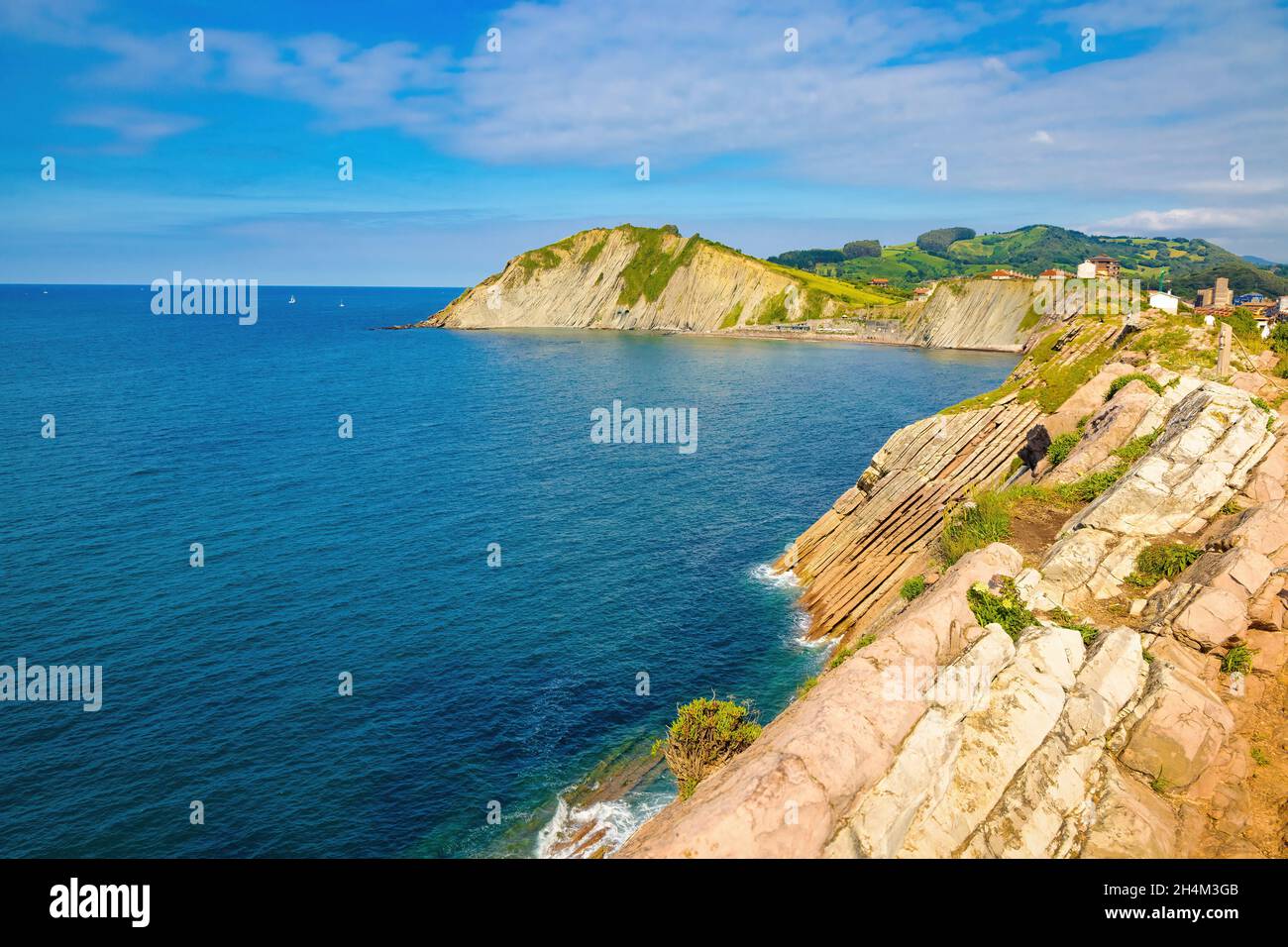 View of the bay of Zumaya with Izurrum beach and the Flysch cliff that protects it. Euskadi, Spain Stock Photo