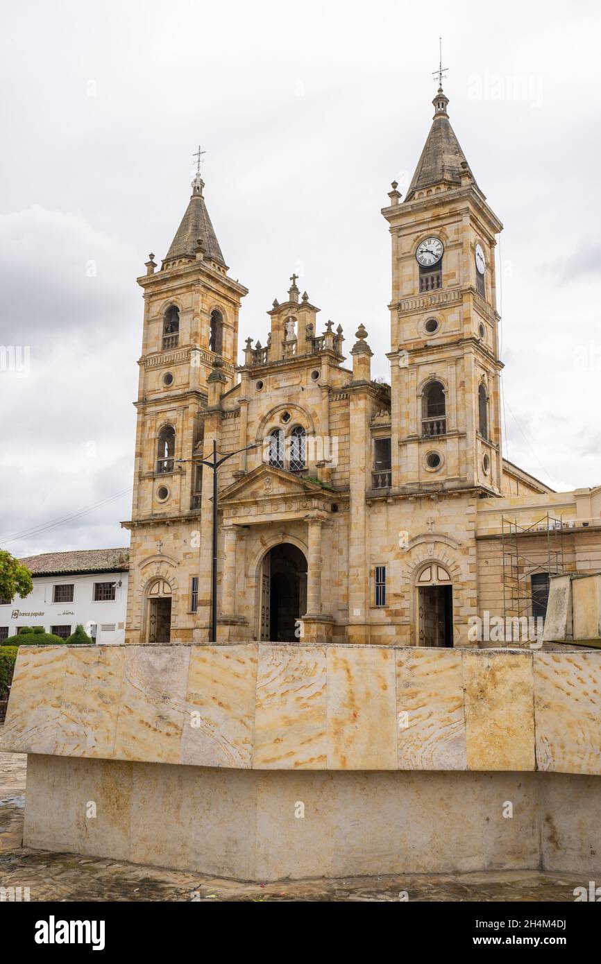 Villapinzón Central Park with the San Juan Bautista Parish in the central city park, in Cundinamarca, Colombia Stock Photo