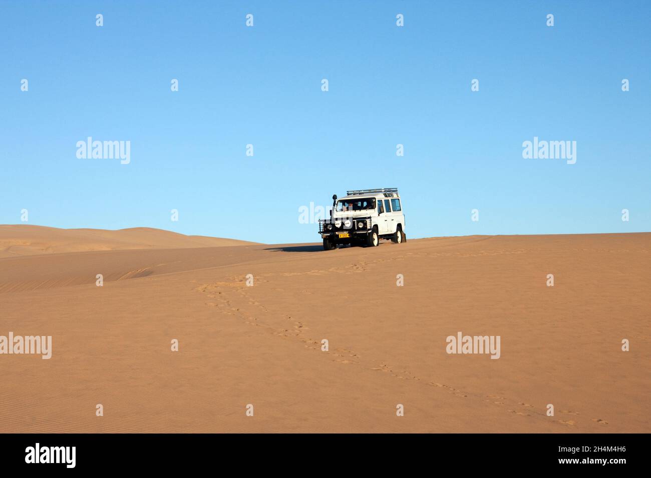 Driving a 4x4 vehicle in the Namib Desert in Namibia, Africa Stock ...