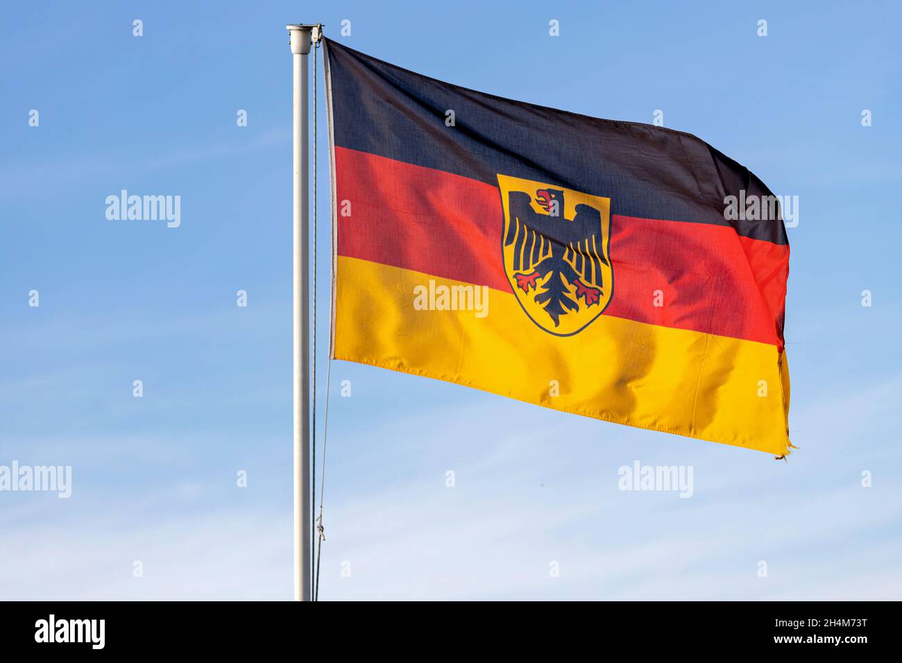 German flag with coat of arms, the so called Bundesdienstflagge, flying