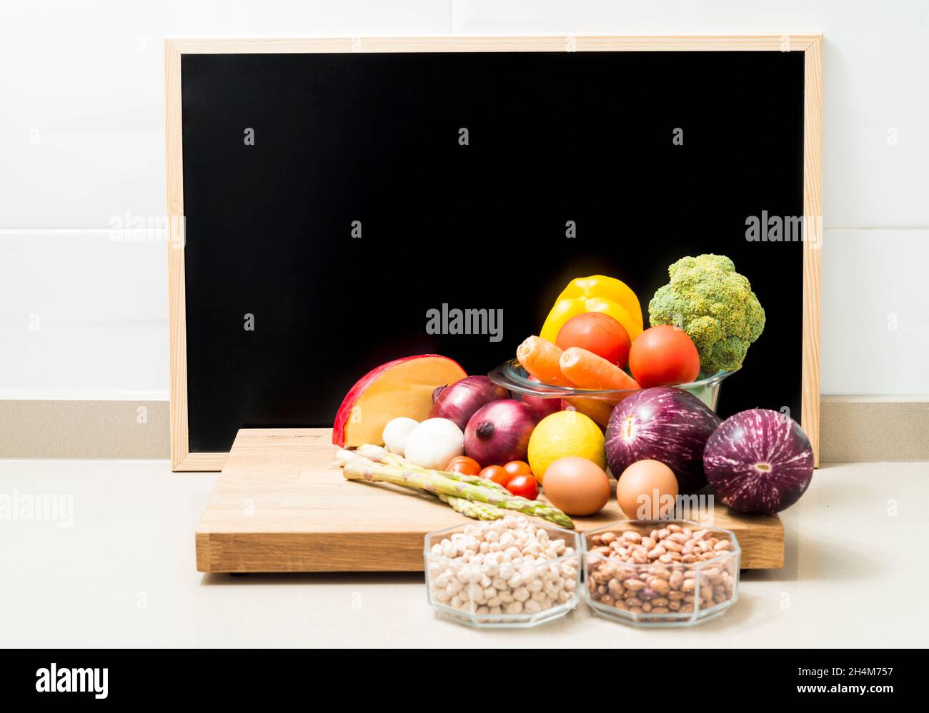 Still life with healthy food and a blackboard with space for copying. Conceptual image about healthy food diets. Copy space. Stock Photo