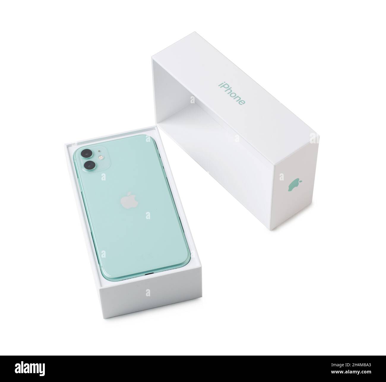 Moscow, Russia - April 20, 2020: Green Apple iPhone 11 with box isolated on a white background. Close-up of a new smartphone from Apple and a box from Stock Photo
