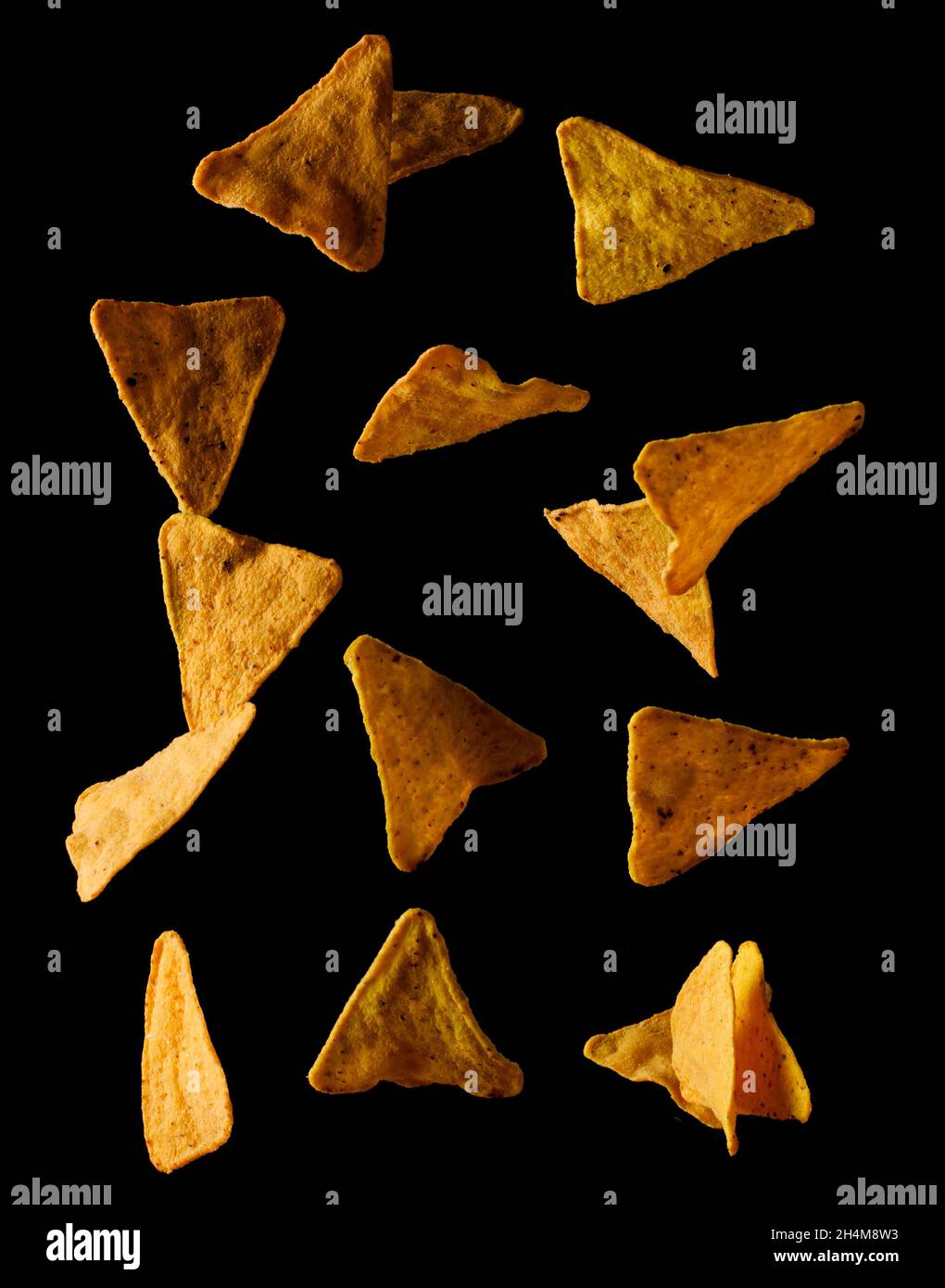 Flying mexican nachos chips, isolated on black background Stock Photo