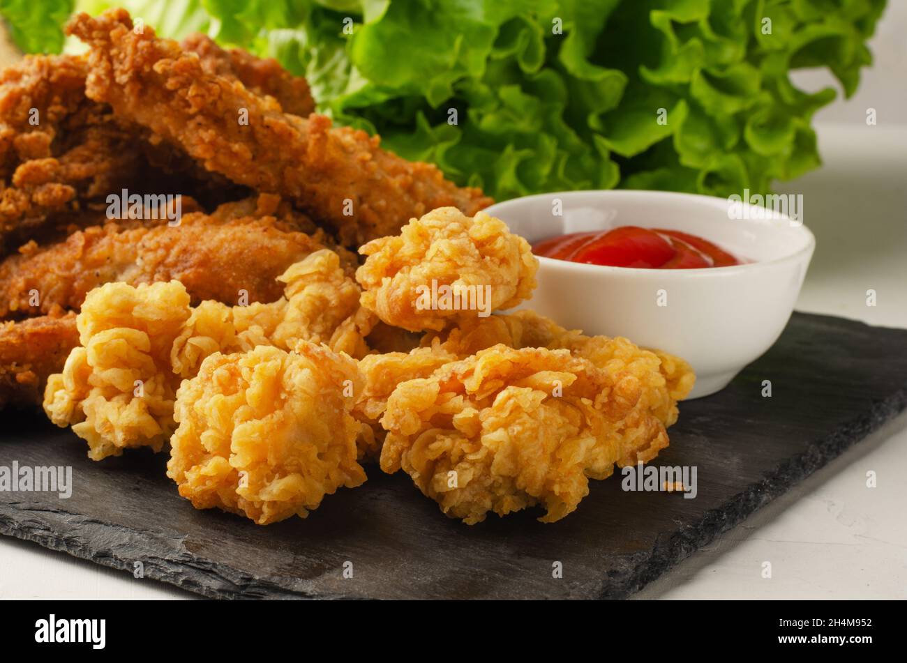 Fried chicken with french fries and nuggets. With ketchup. Stock Photo