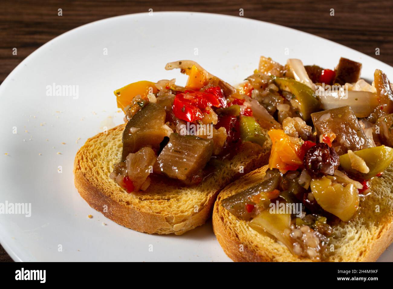 Eggplant appetizer antipasti made with yellow pepper, onion, raisin