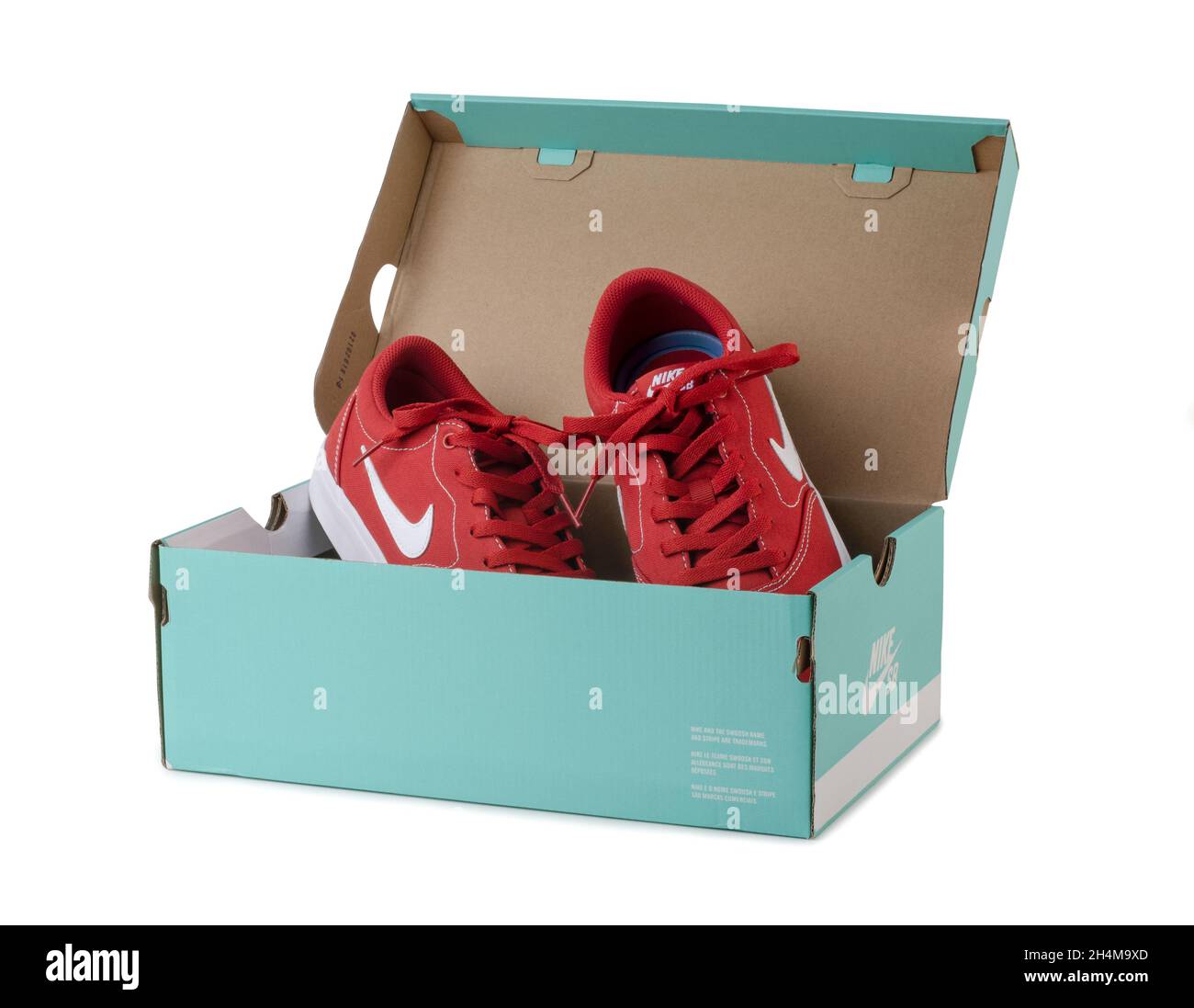 SAMARA, RUSSIA - December, 2020: Red Nike shoes in aquamarine box isolated on white background. Stock Photo