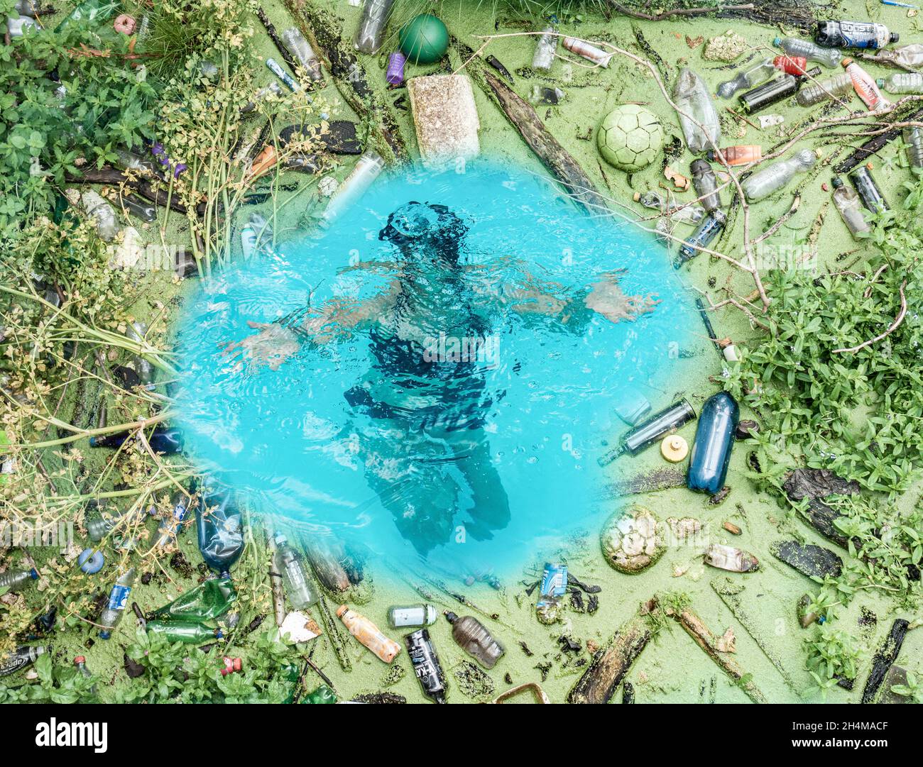 Woman swimming, drowning in ocean surrounded by plastic rubbish. Ocean plastic, plastics, climate change, pollution... composite concept. Stock Photo