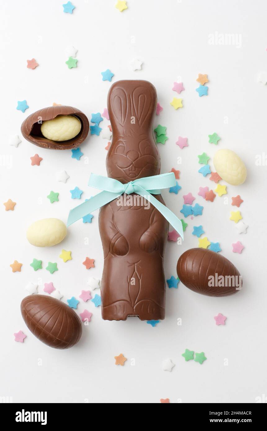 Easter chocolate bunny with chocolate eggs on white background Stock Photo