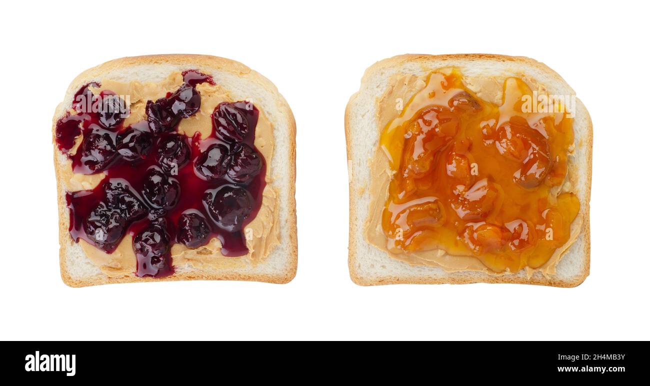 Toasts with butter peanut and cherry and apricot jam. Isolated on a white background. Top view. Stock Photo