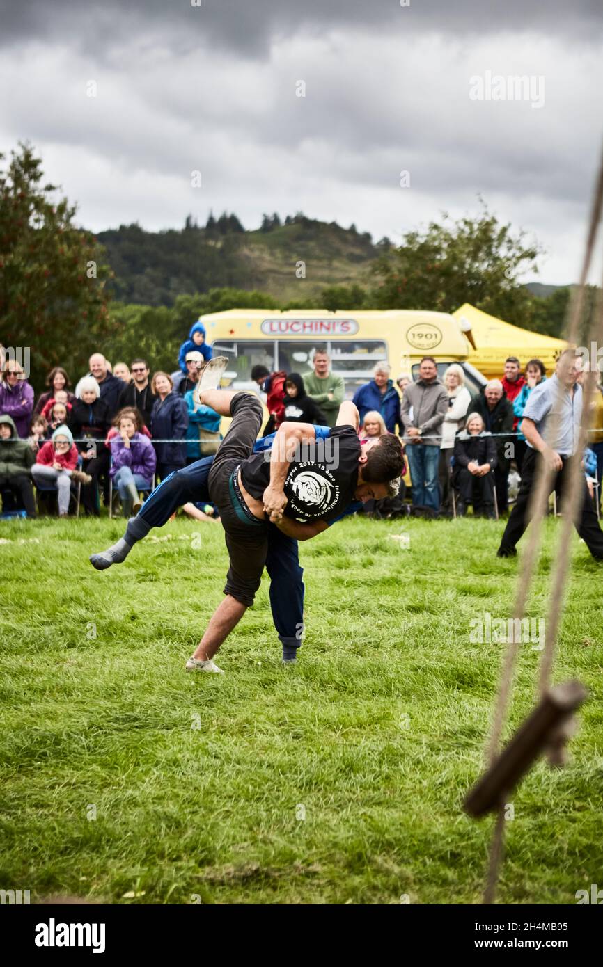 Two men competing in a wrestling match at the Keswick Show in Cumbria, UK. Stock Photo