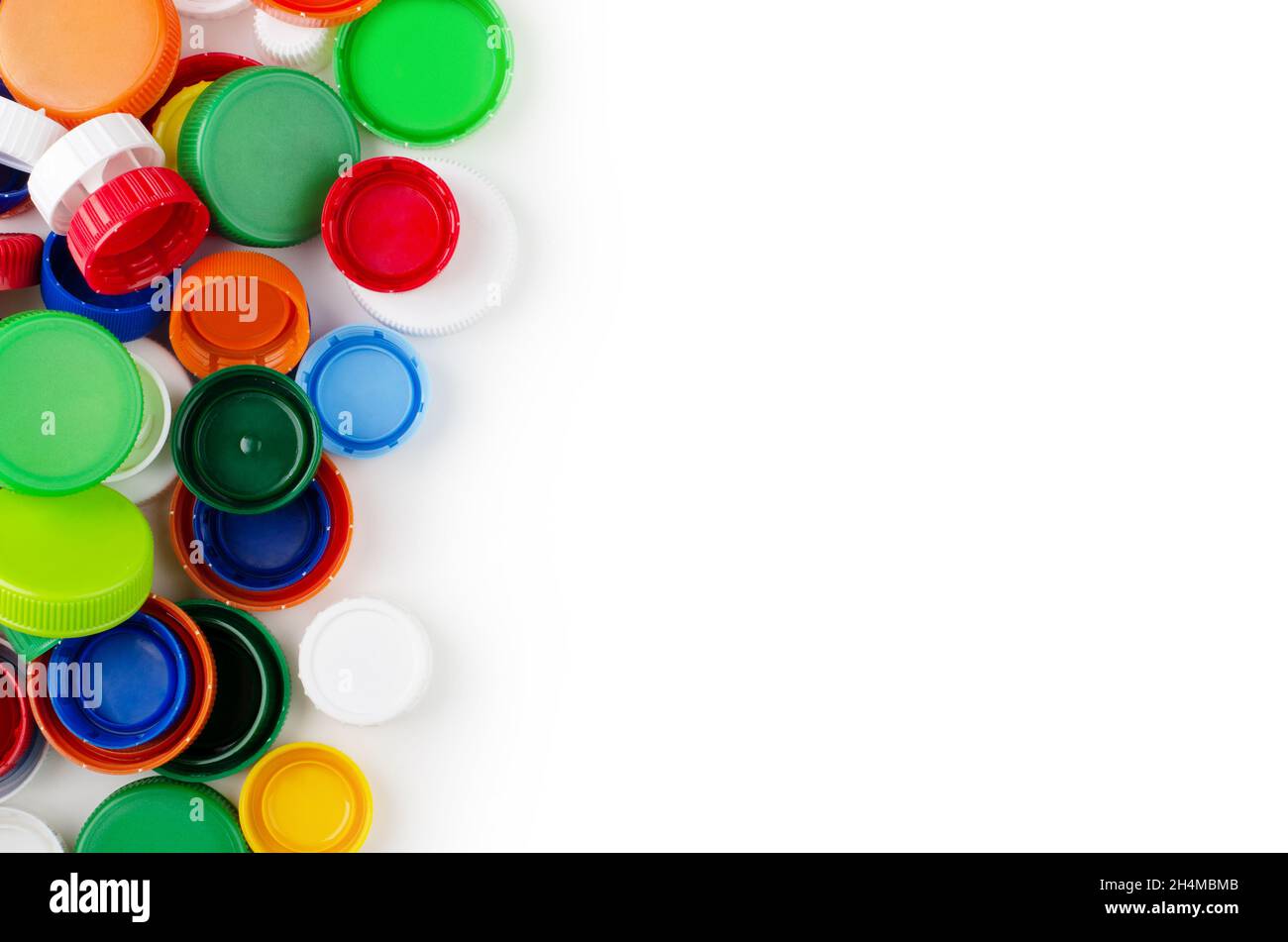 Group of multicolored bottle caps isolated on a white background and space for text Stock Photo