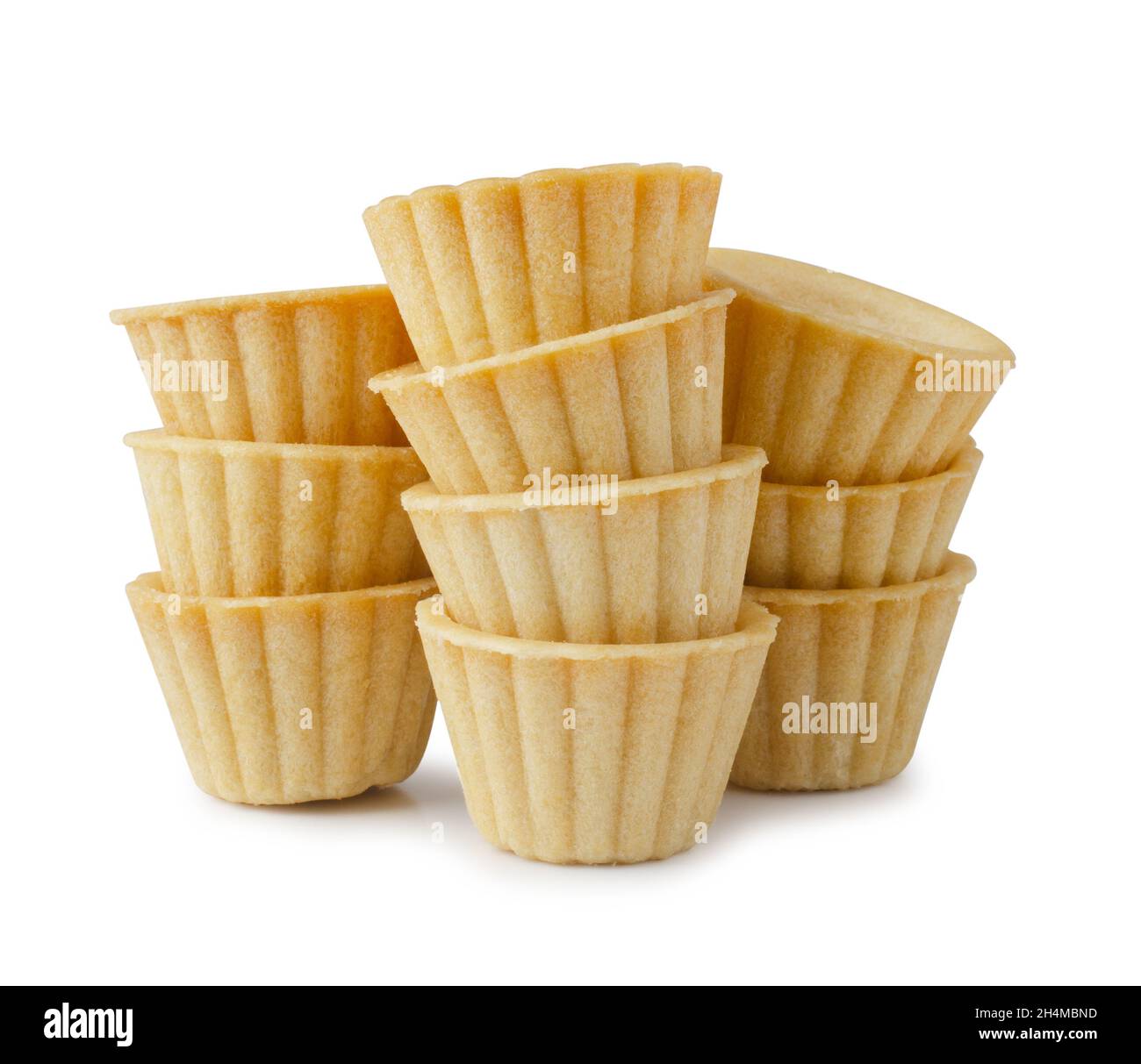 Stack of empty tart shells isolated on white background Stock Photo