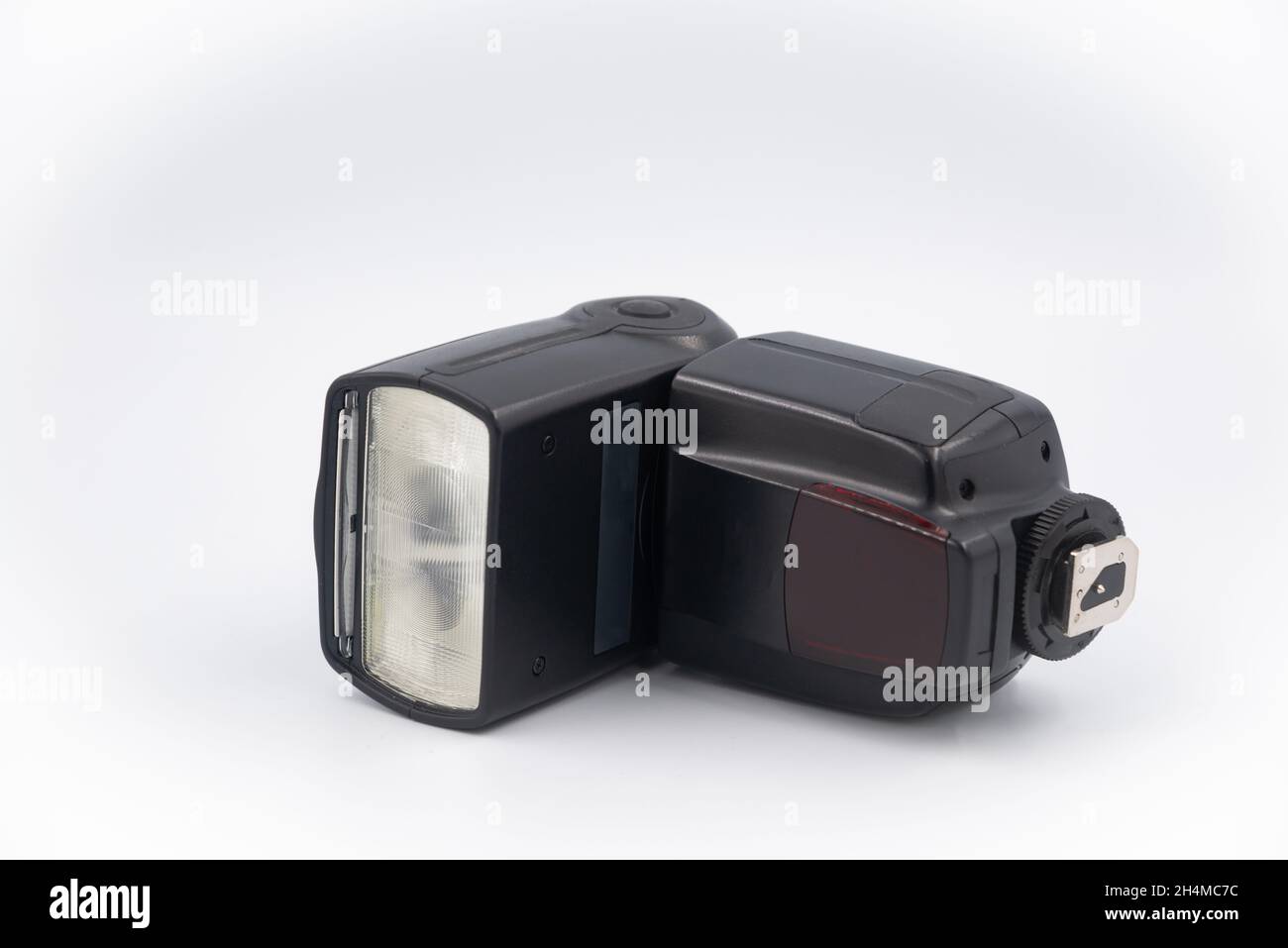 Speedlight isolated on the white background. Camera flash unit features
