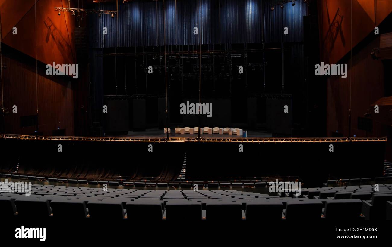 Large theatre hall with stage and balconies. Media. View from back rows