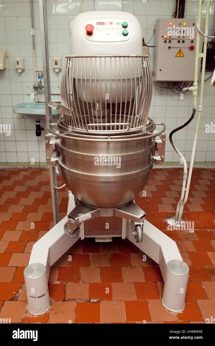 The process of making cookie dough in an industrial kneading machine at